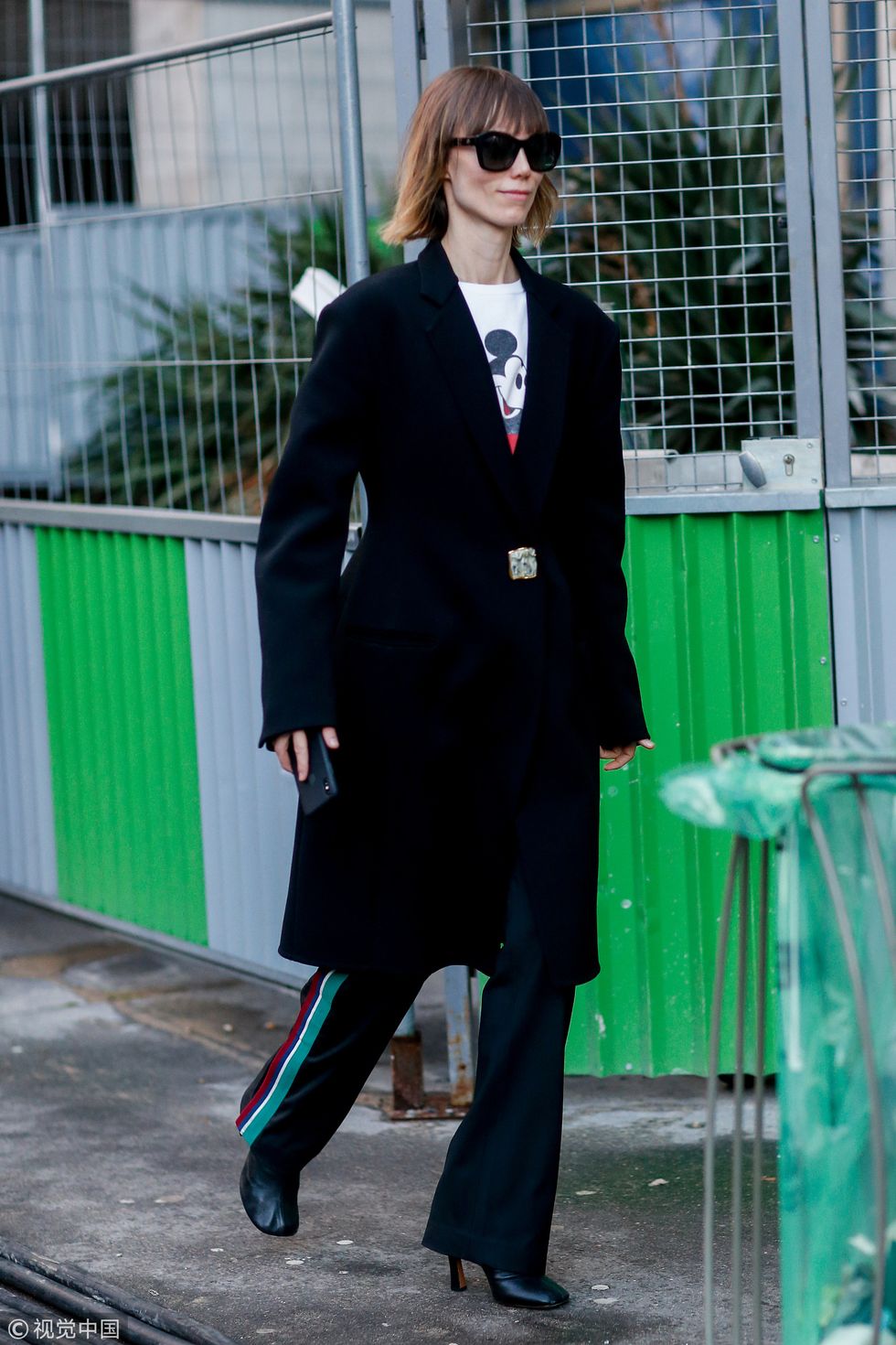 The Elegance of Glasses, Suit, and Tie