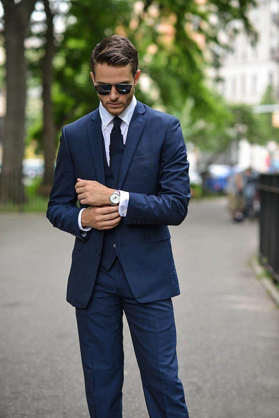 Title: The Stylish Look of a Black and Blue Suit with a Tie