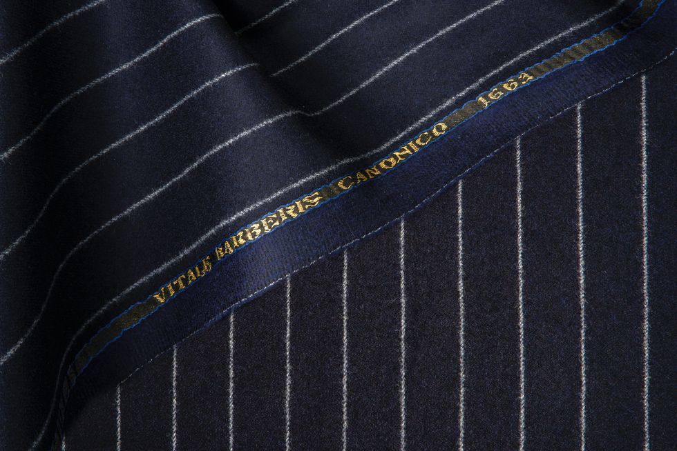 The Story of a Clothing Brand: Blue and Black Tie-Striped Elegance