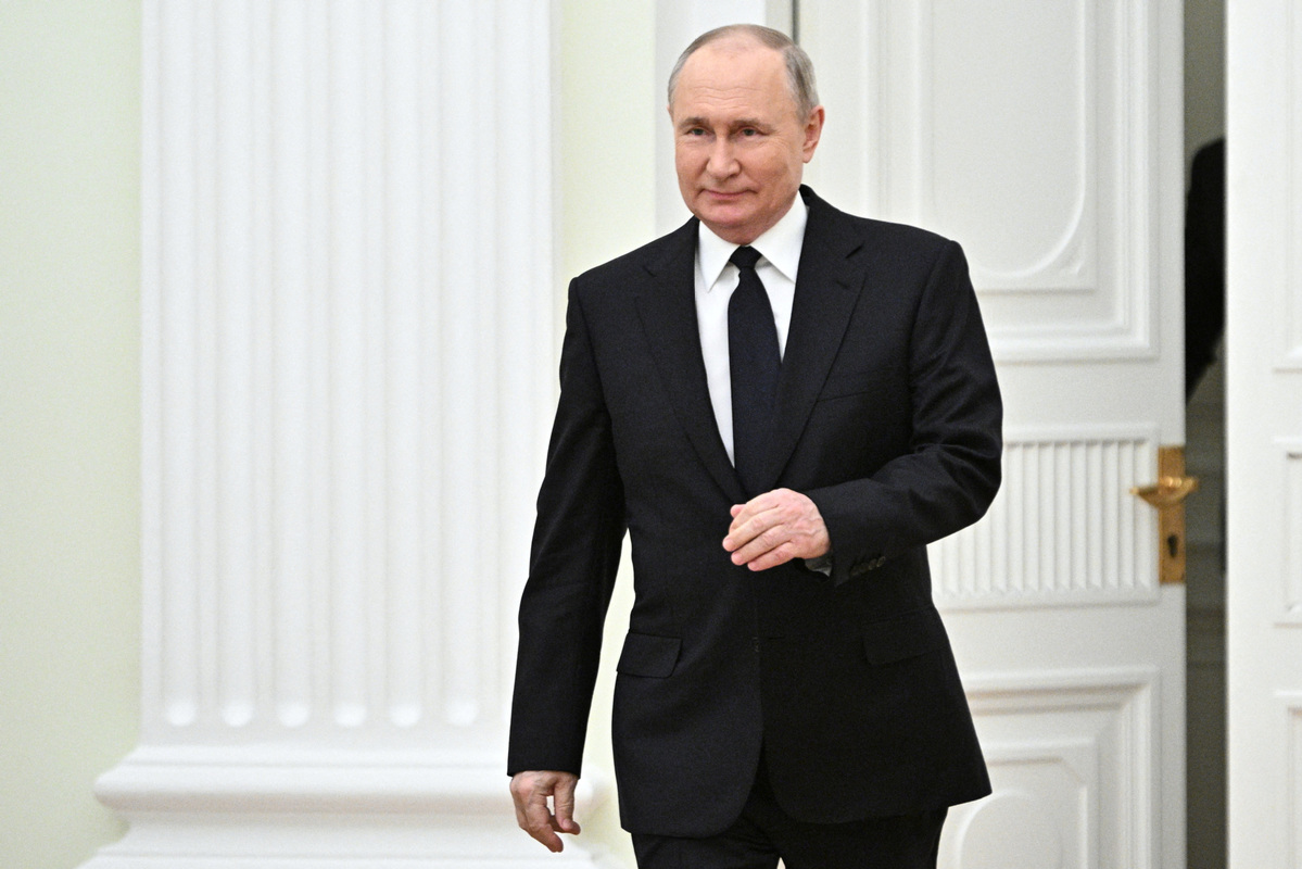 Title: Putin donning a black tie: A glimpse into the presidents style and persona