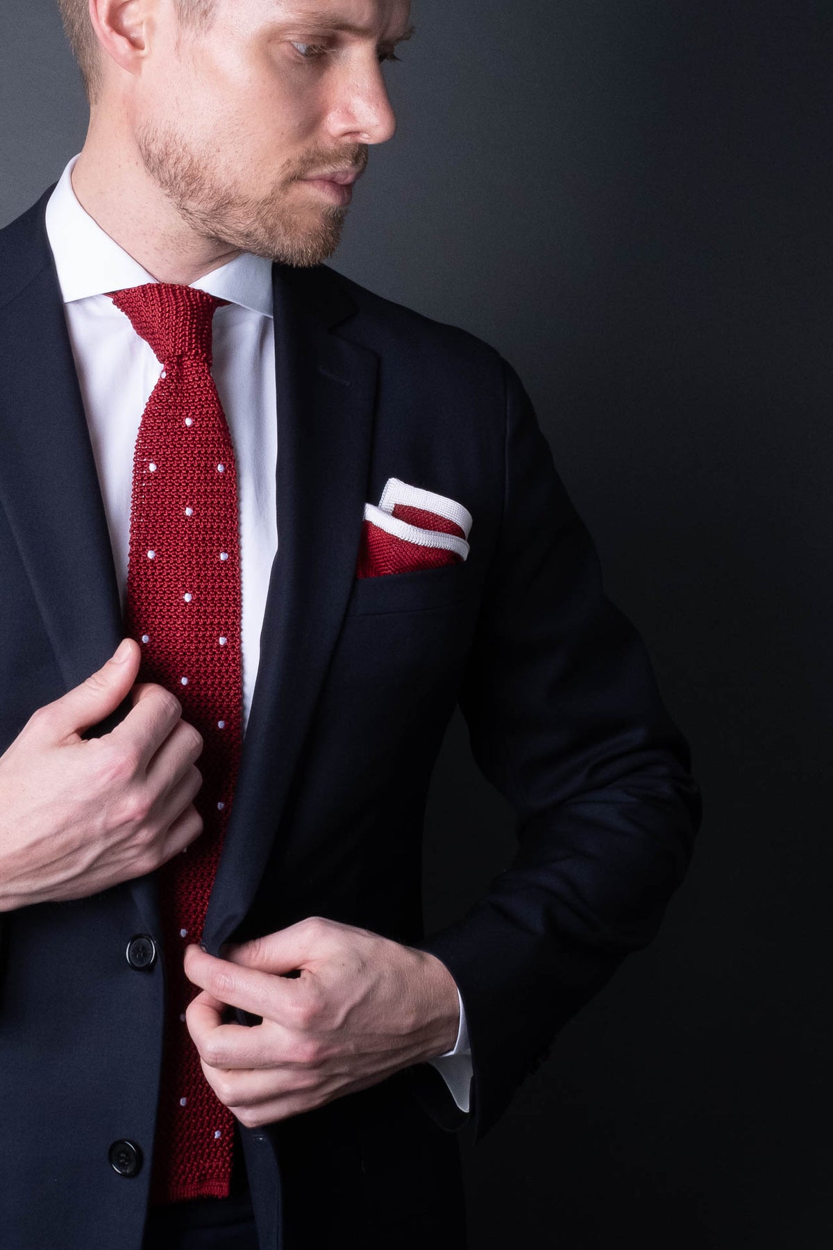 Title: The Contrasting Duo: Black Suit and Tie Paired with a Red one