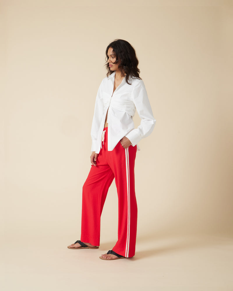 Title: The Perfect Combination: White Blouse, Red Tie, and Black Pants