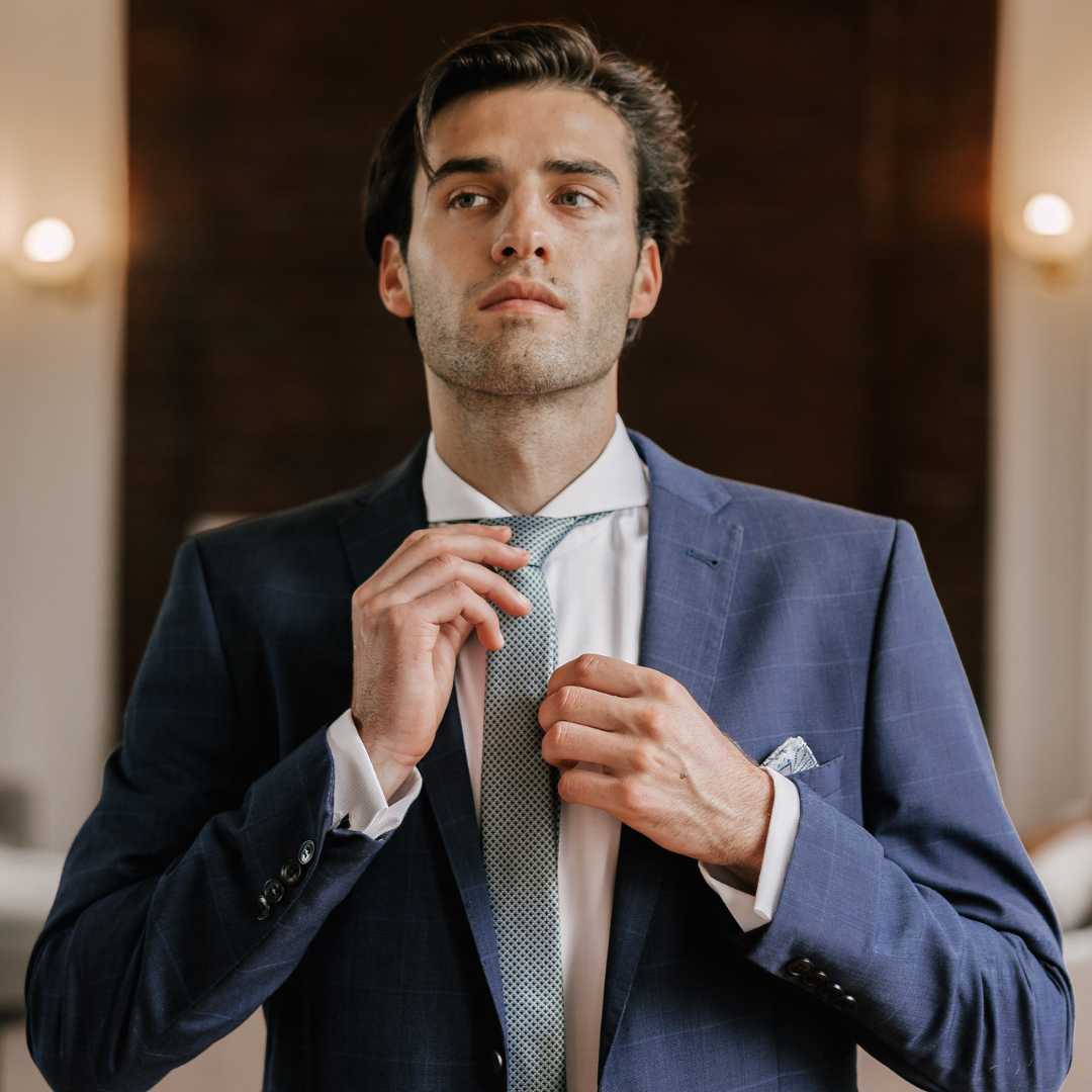 Title: A Stunning Portrait of a Handsome Young Man in a Suit and Tie