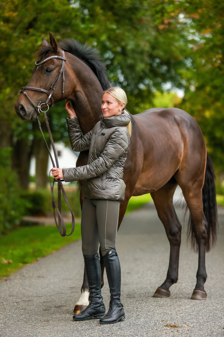 Riding a Horse: The Importance of Wearing a Riding Vest and Tie