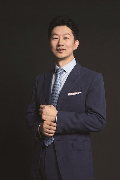 Title: A Heartwarming Photo of Chang Yuan in a Tuxedo and Tie