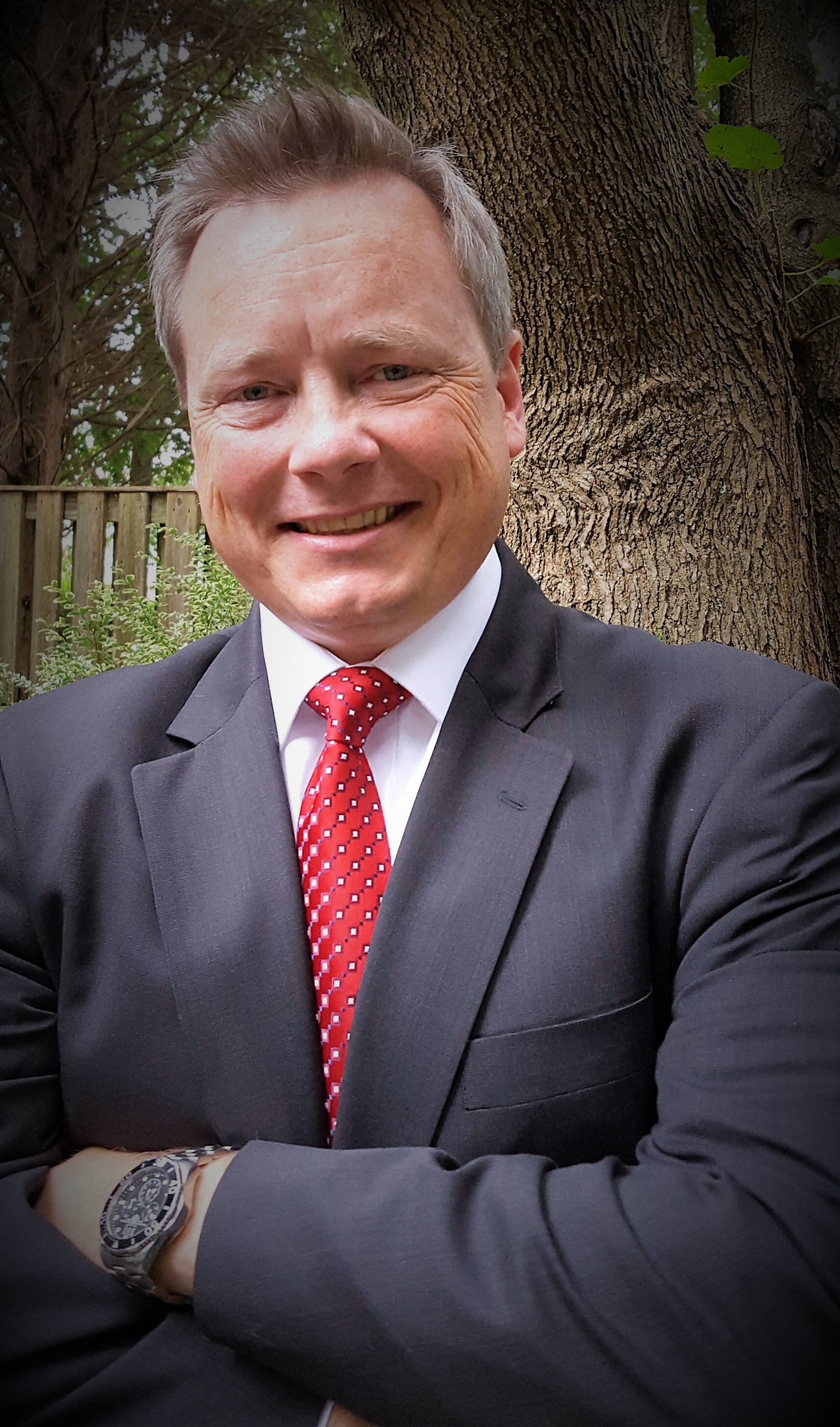 Title: A Smile of a Western-Style Suit and Tie Man with a Mustache