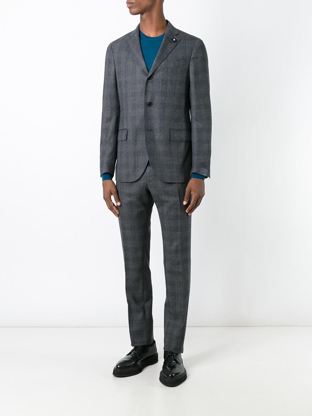 Title: Unconventional Style: A Fashionable Twist on Formal Attire with a Plaid Tie and Suit Coat