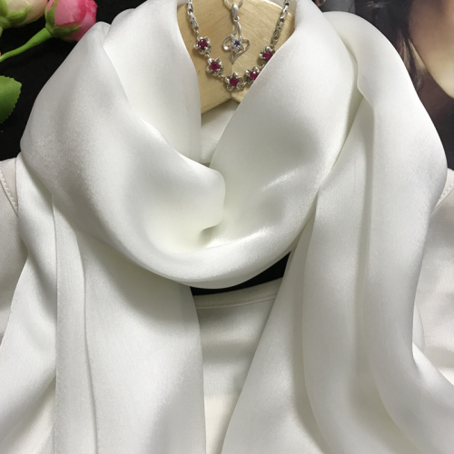 The Elegance of a White Tie and Silk Scarf