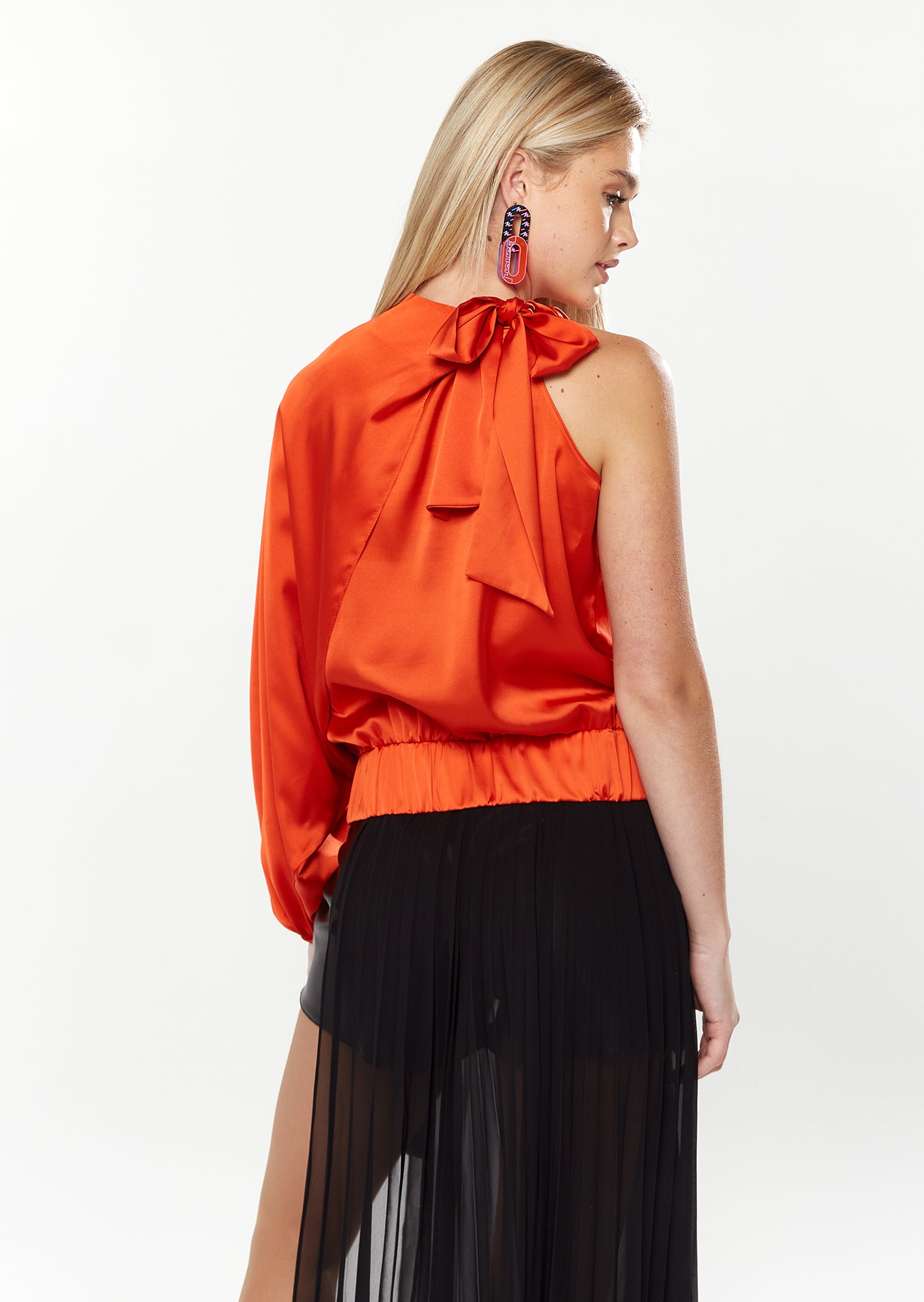 Title: The Unique Fashion Statement of a Lady in an Orange Tie