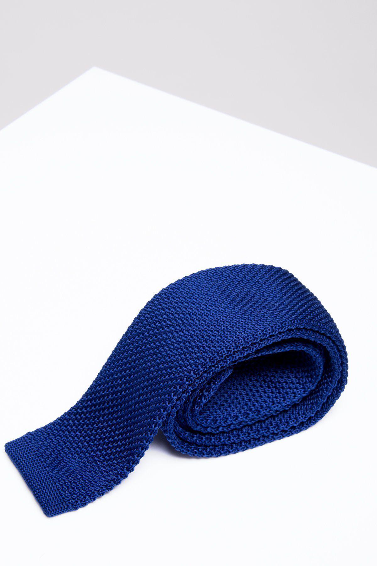 The Enchanting allure of a Knitted Blue Tie