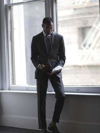 The Unique Charm of Gray Suit with Striped Tie