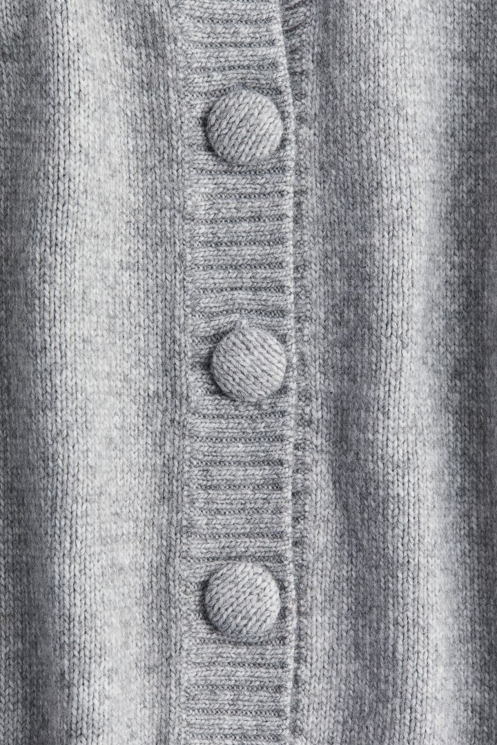 The Unique Charm of a Grey Tie with Buttons