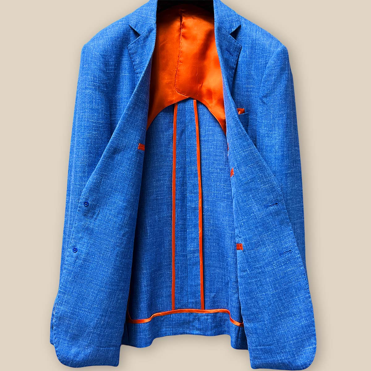 The Unique Charm of a Blue Suit with an Orange Tie