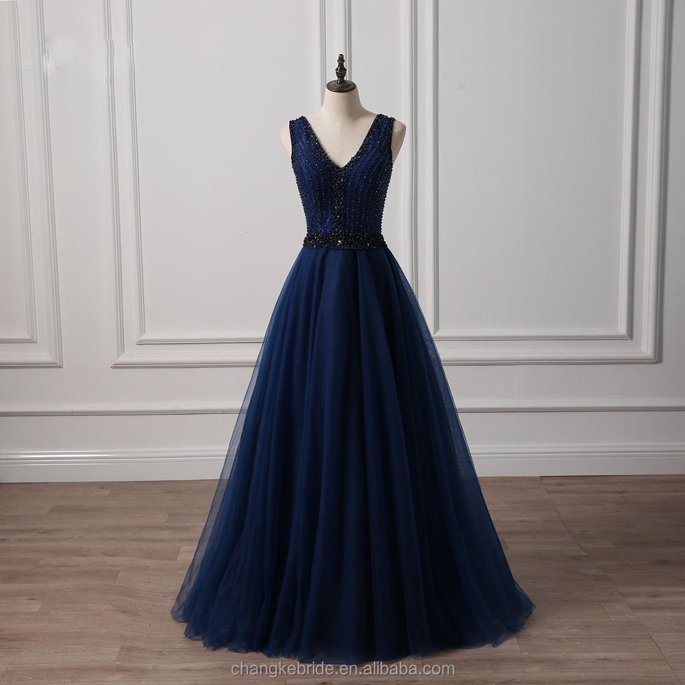 The Elegant Allure of Blue Ties and Promenaded Gowns