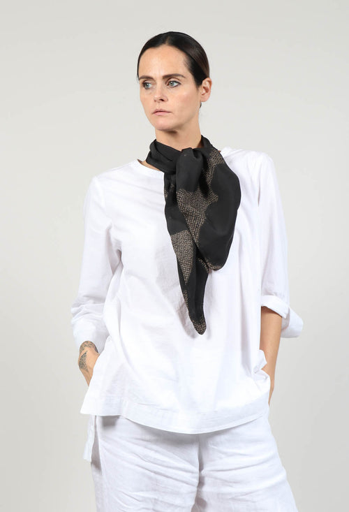 The Timeless Elegance of a Checkered Scarf and Ribbon Tie