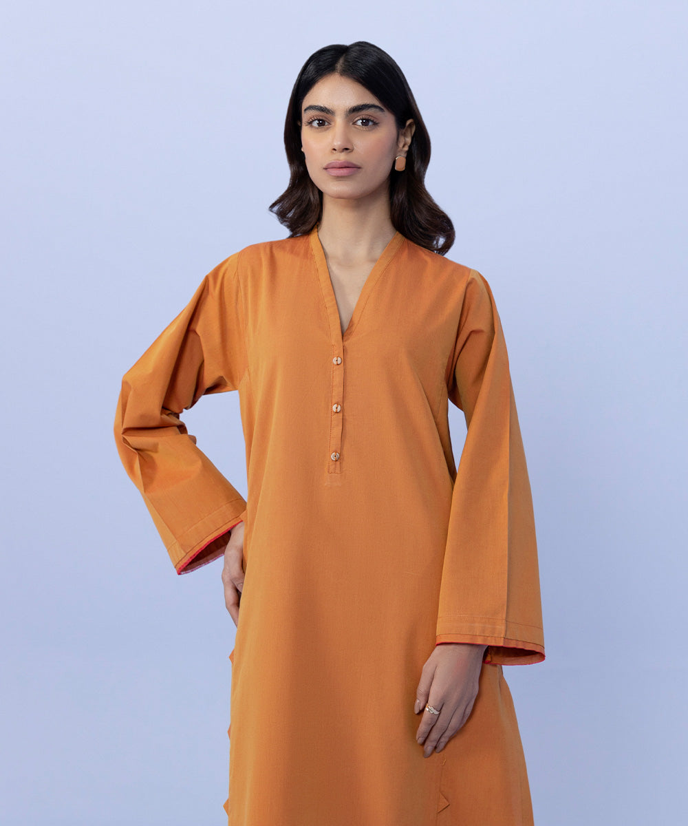 The Unique Charm of Orange-Tied Clothing