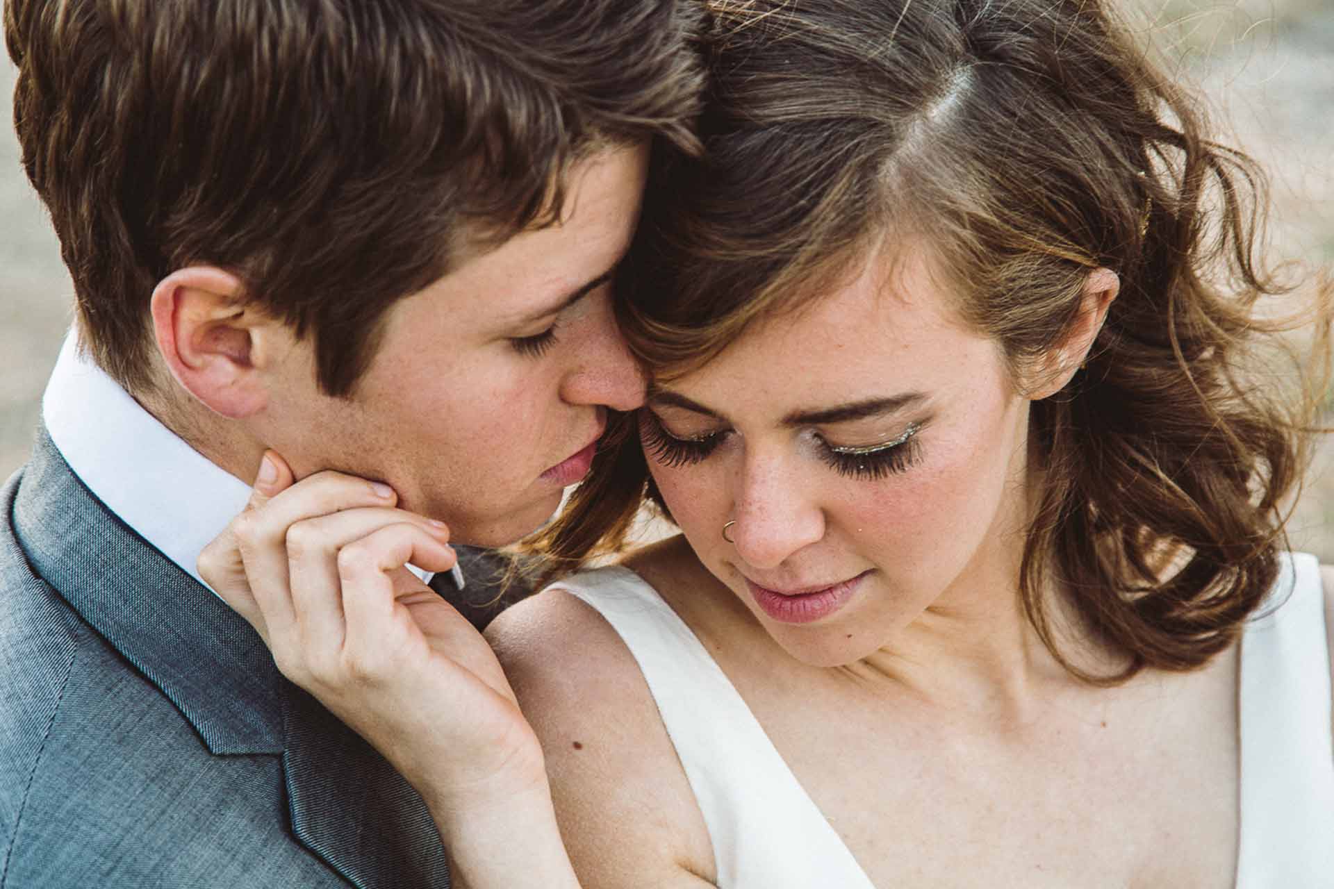 The Romantic Gesture of Untying a Tie in a Couples Photo